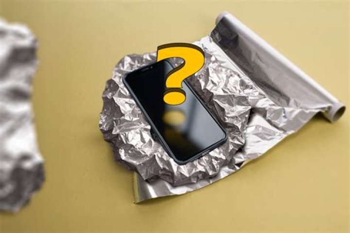 How can I boost my cell phone signal with aluminum foil?
