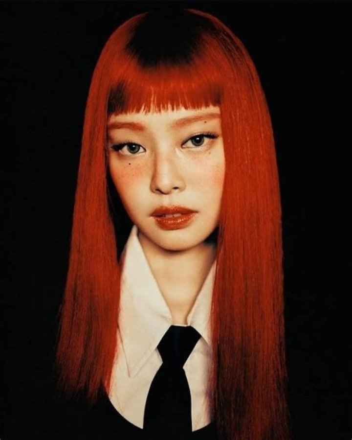 What does it mean when a girl dye her hair red?