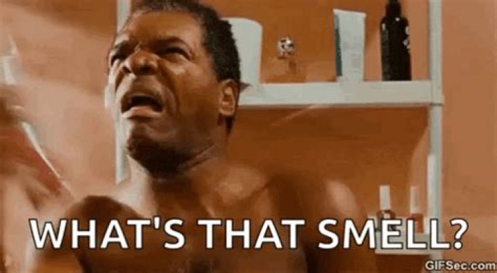 Why do you smell funny after tanning?